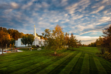 The Palmyra New York Temple with a green field.