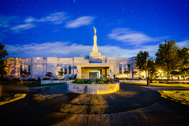 The Medford Oregon Temple lit up in the evening.