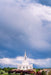 The Orem Utah Temple with a cloudy blue sky.