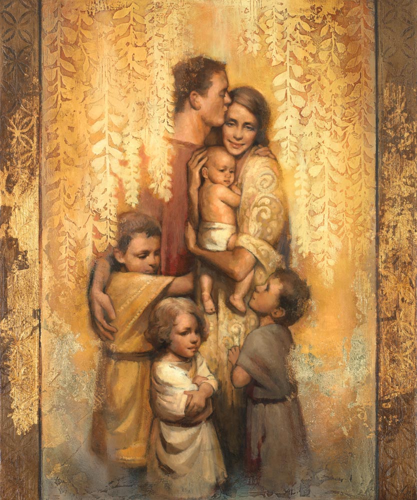 Husband and wife and children standing in a group hug.