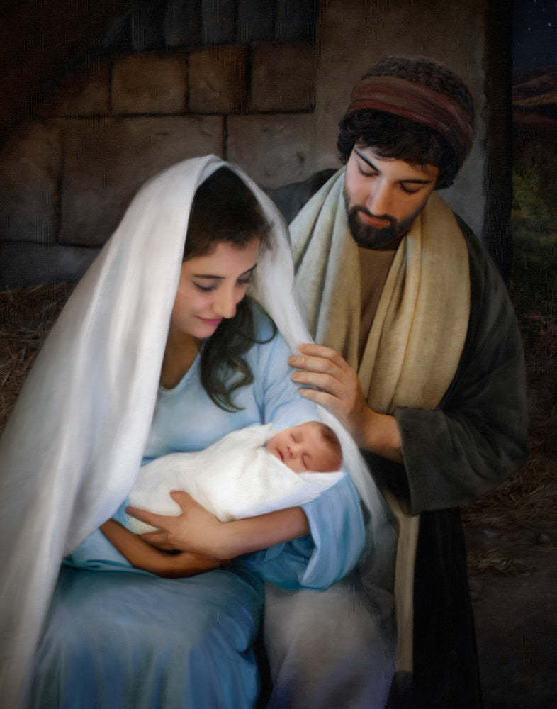 Mary and Joseph holding baby Jesus. 