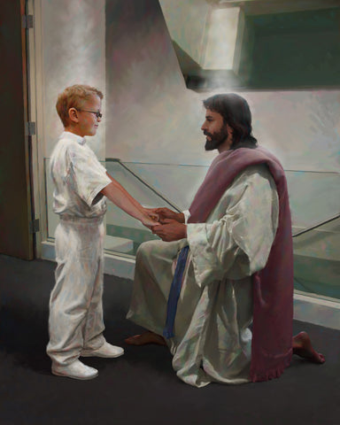 Boy dressed in white in front of a baptismal font with Jesus holding her hands. 