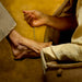 A woman washing the feet of Jesus Christ.