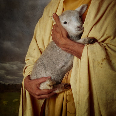 Jesus Christ holding his sheep. 