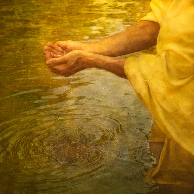 Christ's hands cupping water from a clear stream.