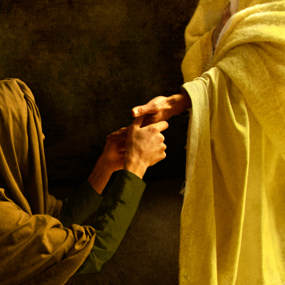 Thomas touching the scars in Jesus' hand.