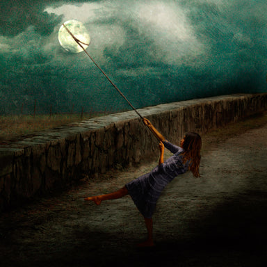 A girl has a rope around the moon and is trying to pull it down.