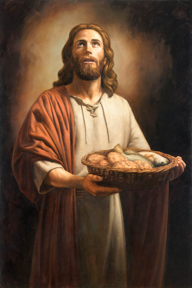 Jesus Christ holding a basket of loaves and fishes.