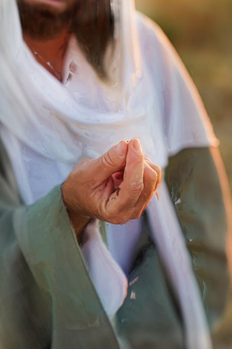 Jesus holding a mustard seed in between His fingers.