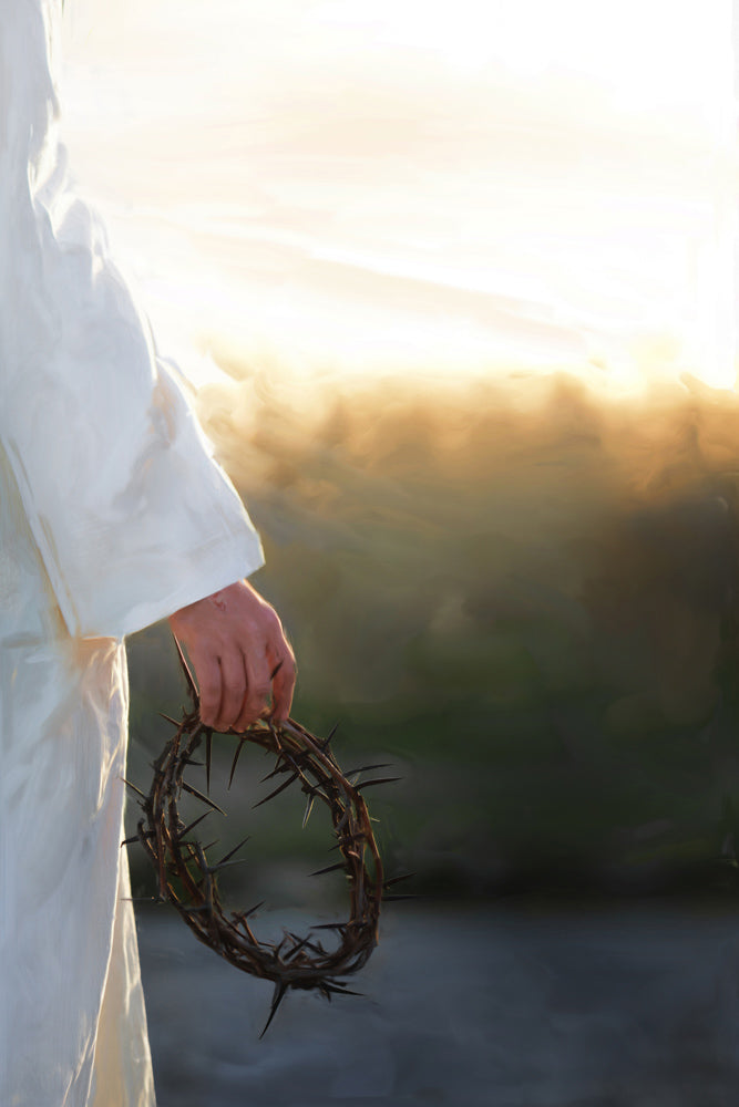 Jesus holding the crown of thorns. The sun shines brightly on Him.