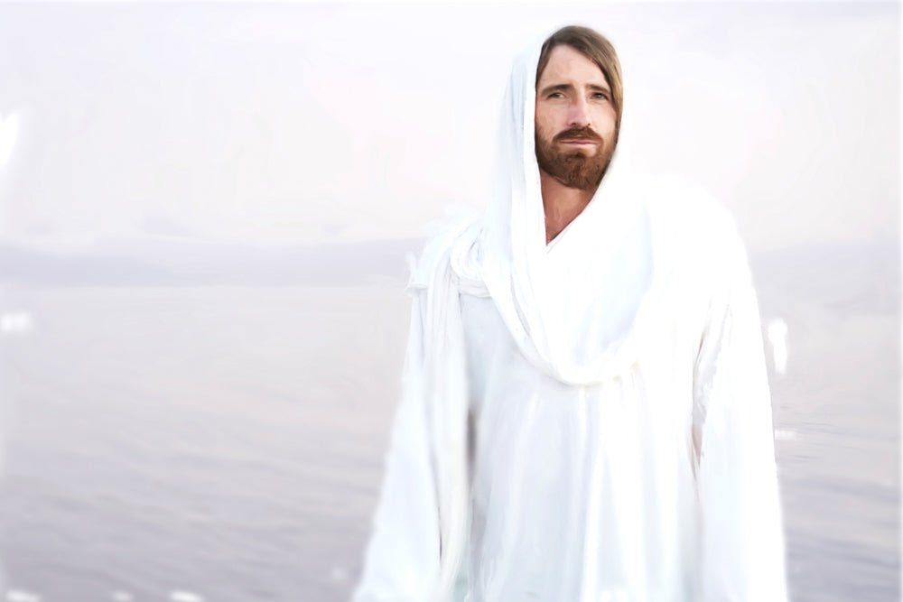 Whited-out image of Jesus standing in front of a body of water.