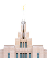 A close up of the Saratoga Springs Utah temple's spire, lightly dusted with snow.