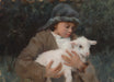 Young shepherd holding a white lamb. 