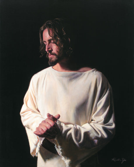 Portrait of Jesus with hands together against a black background. 