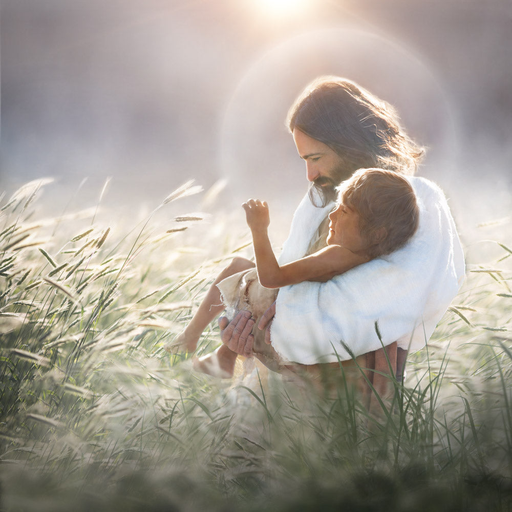Jesus holding young boy in wheat field. 