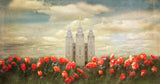 Salt Lake Utah Temple with red tulips in front panoramic. 