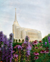 Rexburg Idaho Temple with purple flowers and blue sky. 