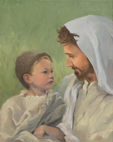 Jesus holding a young boy. 