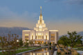 The Saratoga Springs Utah temple with trees and mountains.