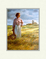 A pioneer women holding a basket of wildflowers in a field with a covered wagon in the background. ARt 3