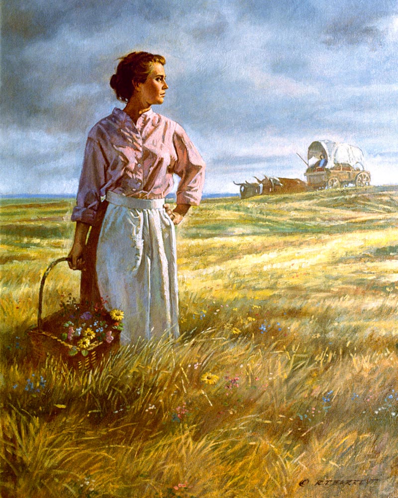 A pioneer women holding a basket of wildflowers in a field with a covered wagon in the background. 
