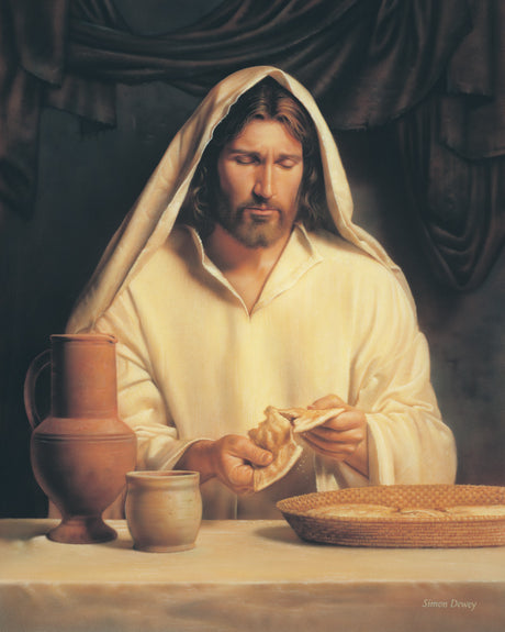 Christ preparing the sacrament by breaking bread for the last supper.