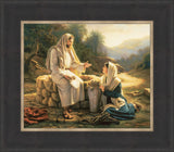 The Samaritan woman kneels beside the well as Jesus teaches her.