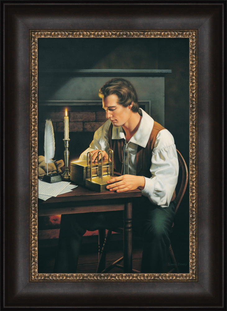 Joseph Smith is seated at a table examining the gold plates. Art 4