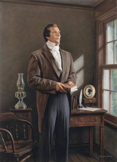 Joseph Smith holding a copy of the Book of Mormon in his office.