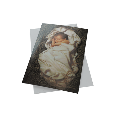 Close-up of boxed Christmas cards with a baby Jesus design, beautifully crafted for holiday greetings and celebrations.