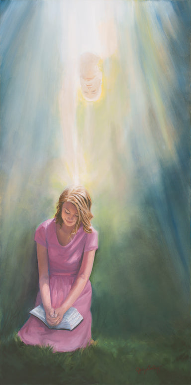 Young women in a pink dress praying with angel enlightening her from above. 